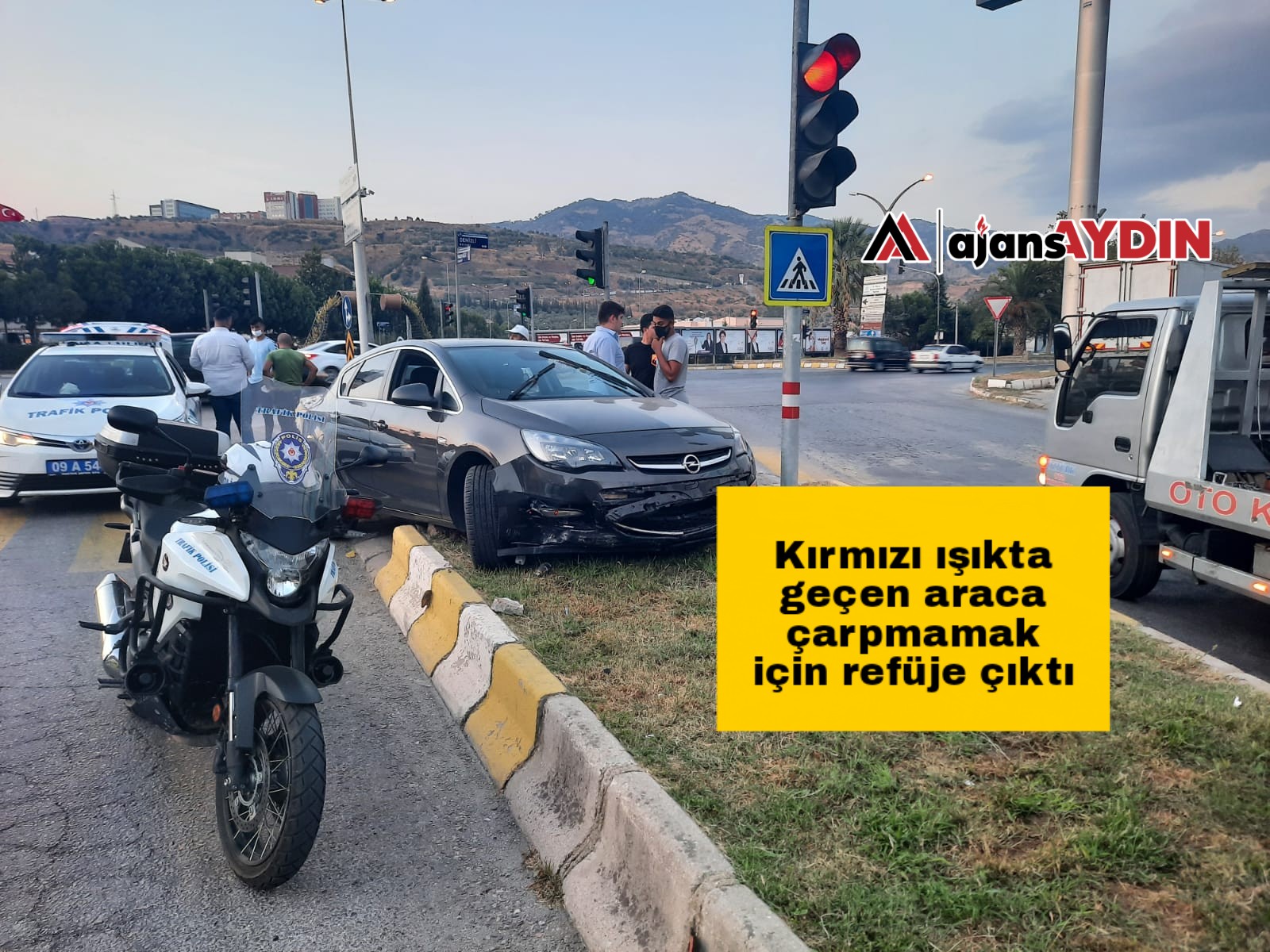 Kırmızı ışıkta geçen araca çarpmamak için refüje çıktı
